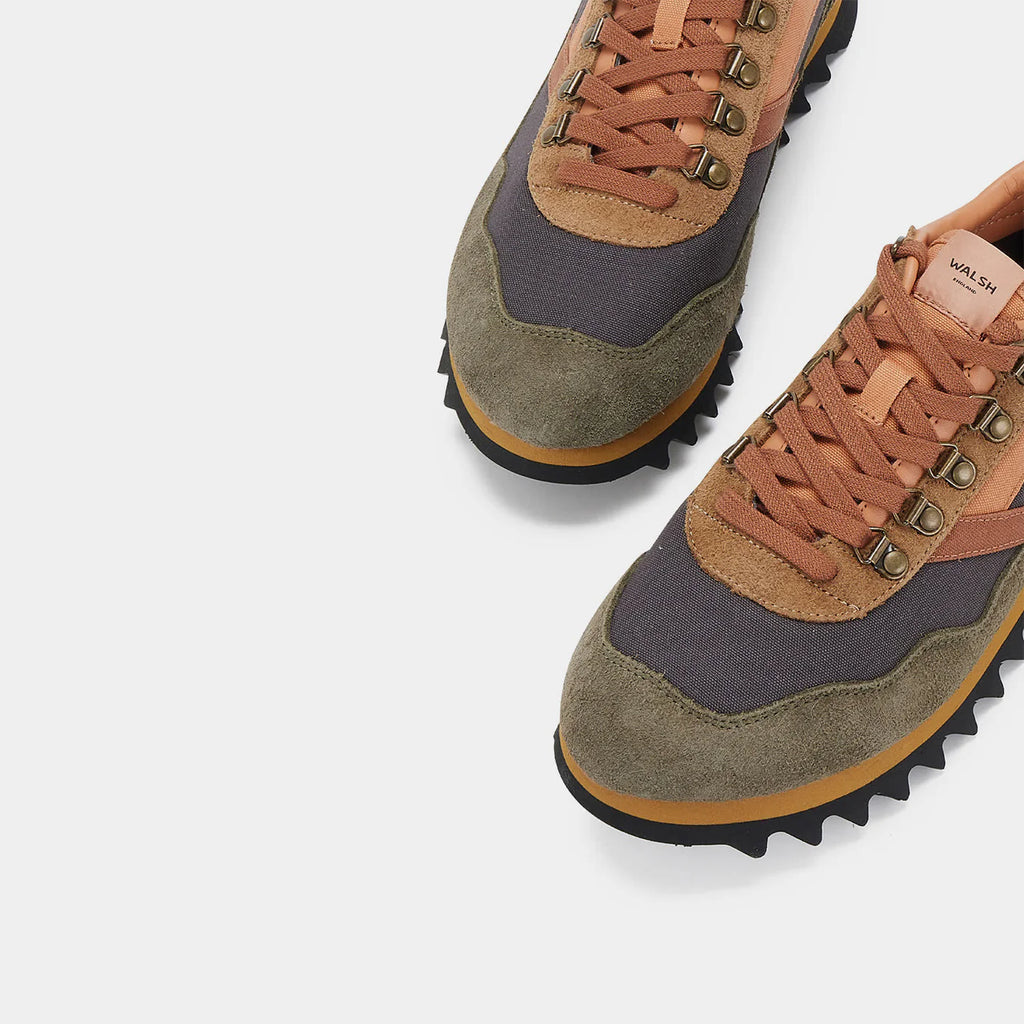 Detailed view of the Norman Walsh Ensign hiking shoe in Black, Grey, Brown, and Army Green with a Vibram outsole.