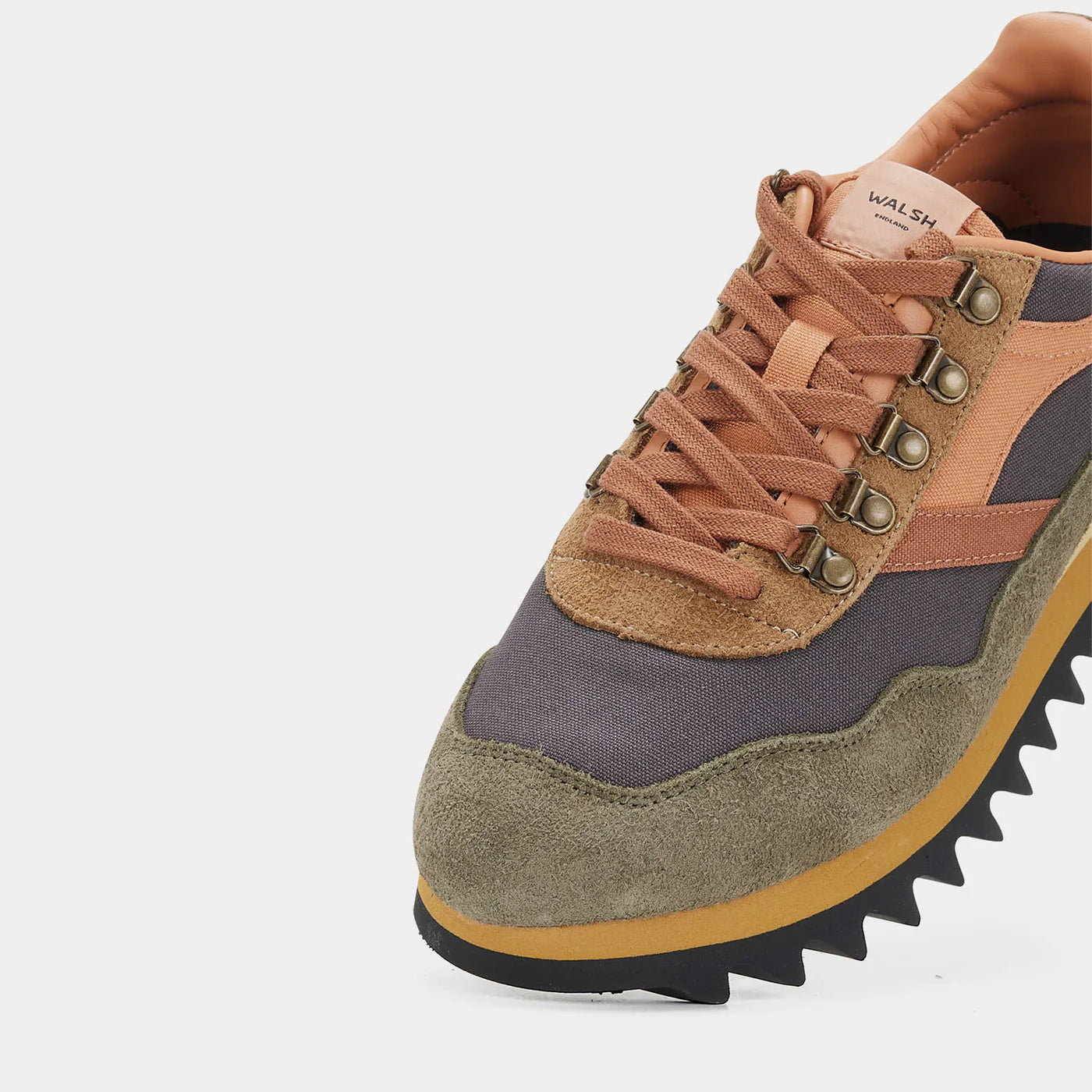 Close-up view of the Norman Walsh Ensign hiking shoe in Black, Grey, Brown, and Army Green with a Vibram outsole.