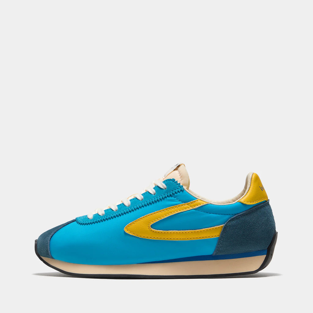 Side view of the London Aqua Blue sneaker, showing the refined 1970s Scintilla silhouette and weather-resistant material textures.
