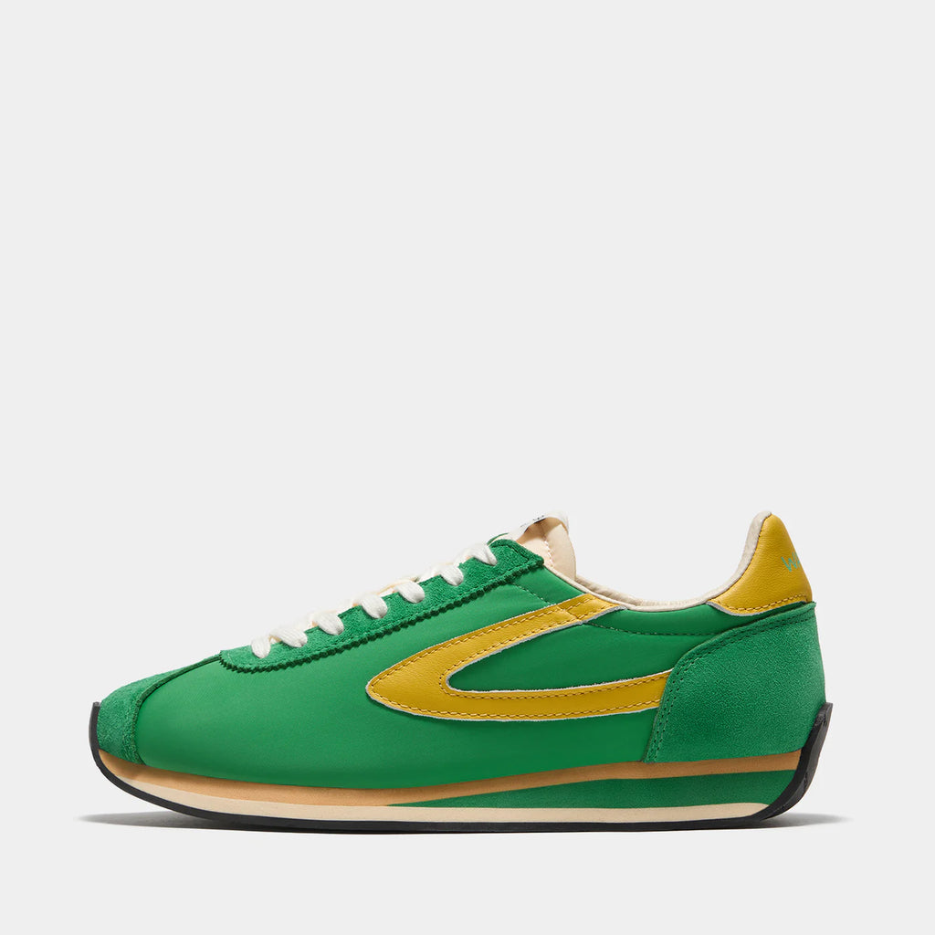Side view of the London Vintage Green sneaker, showing the refined 1970s Scintilla silhouette and weather-resistant material textures.