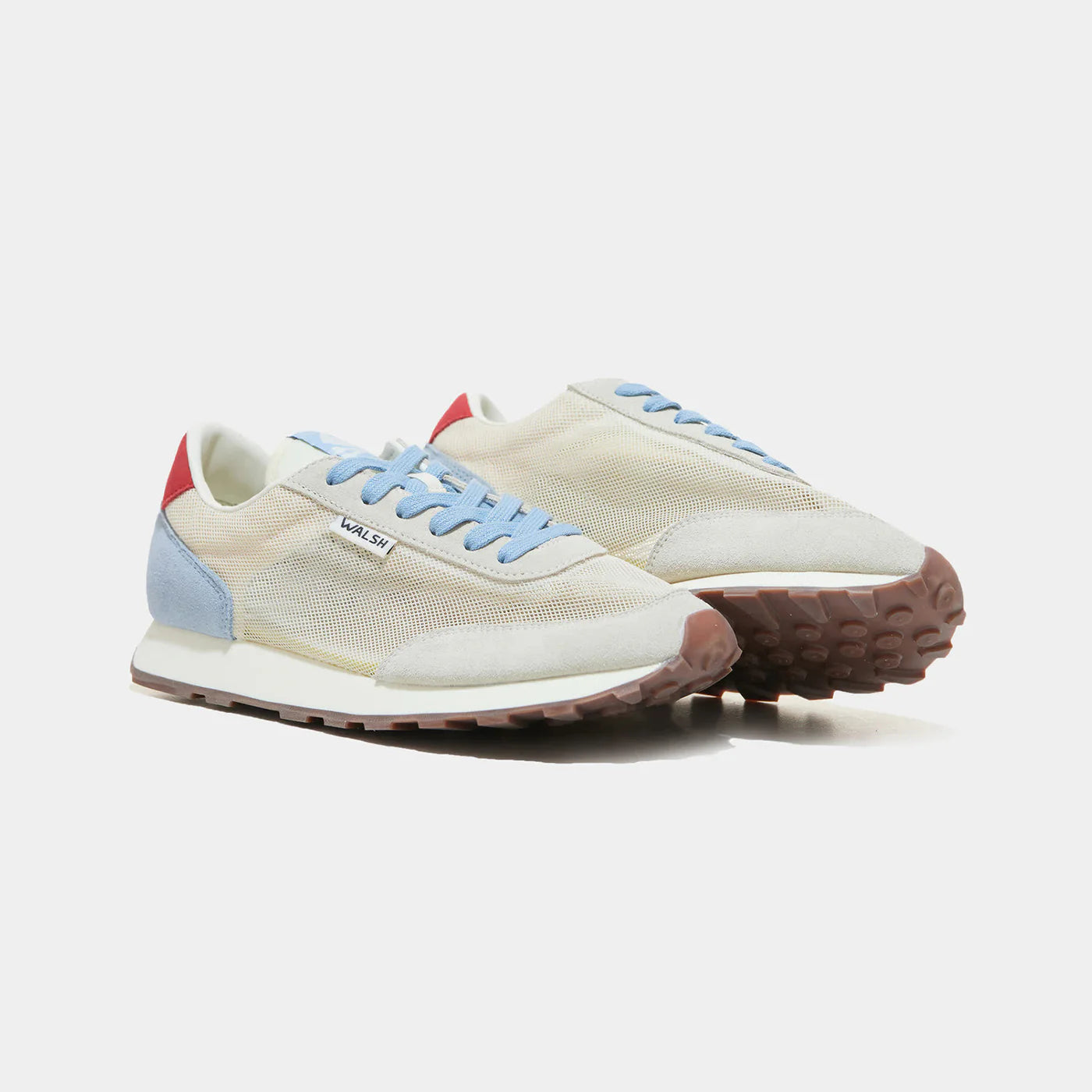 The front view of Norman Walsh LA84 Sky Blue & Red — an Olympics-inspired retro runner with perforated mesh upper, EVA cushioning & rubber outsole. 