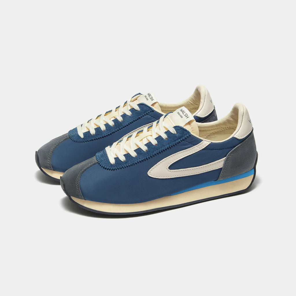 Front view of the London Navy Blue sneaker, showing the refined 1970s Scintilla silhouette and weather-resistant material textures.