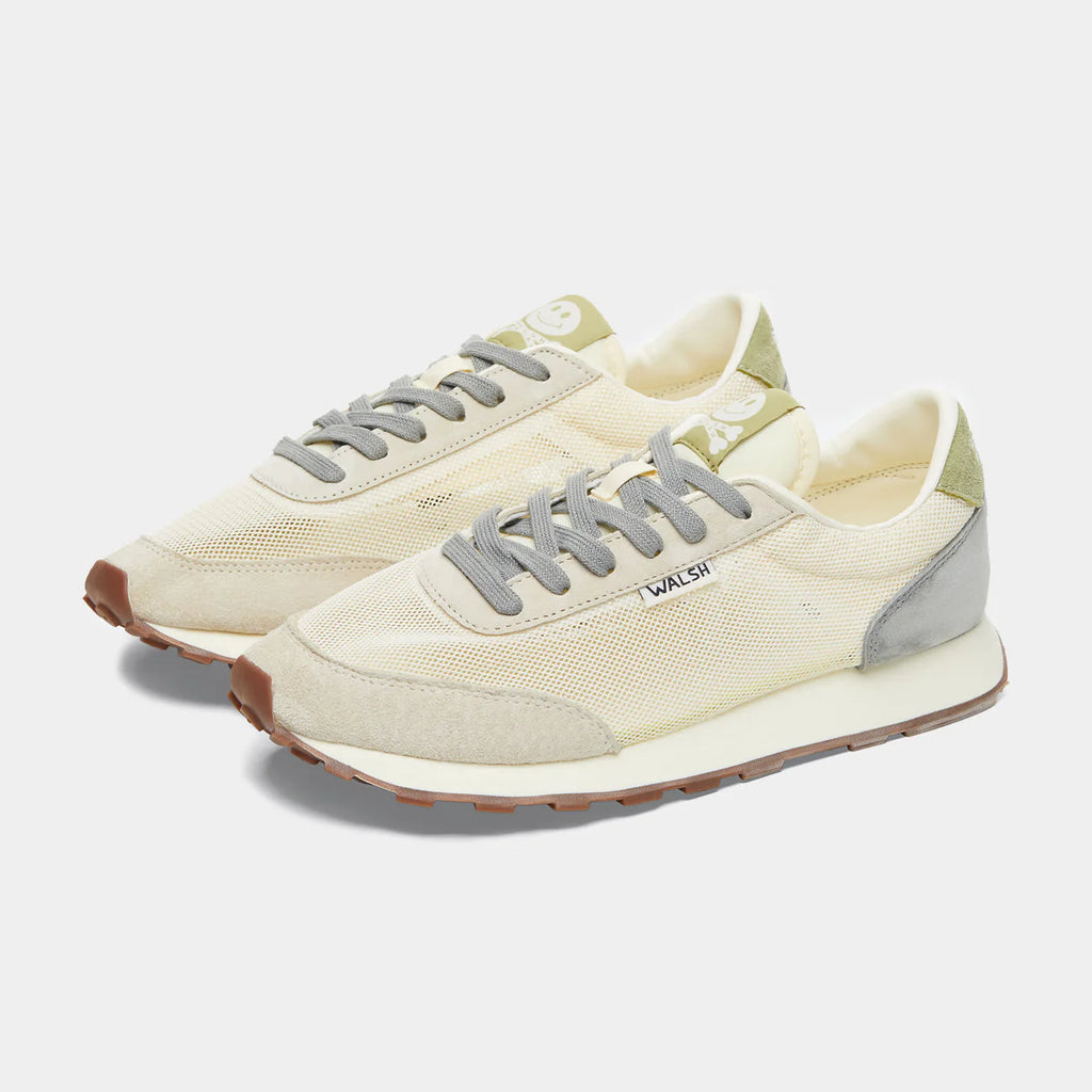 The front view of Norman Walsh LA84 Beige & Haze Green — an Olympics-inspired retro runner with mesh upper, EVA cushioning & rubber outsole. 