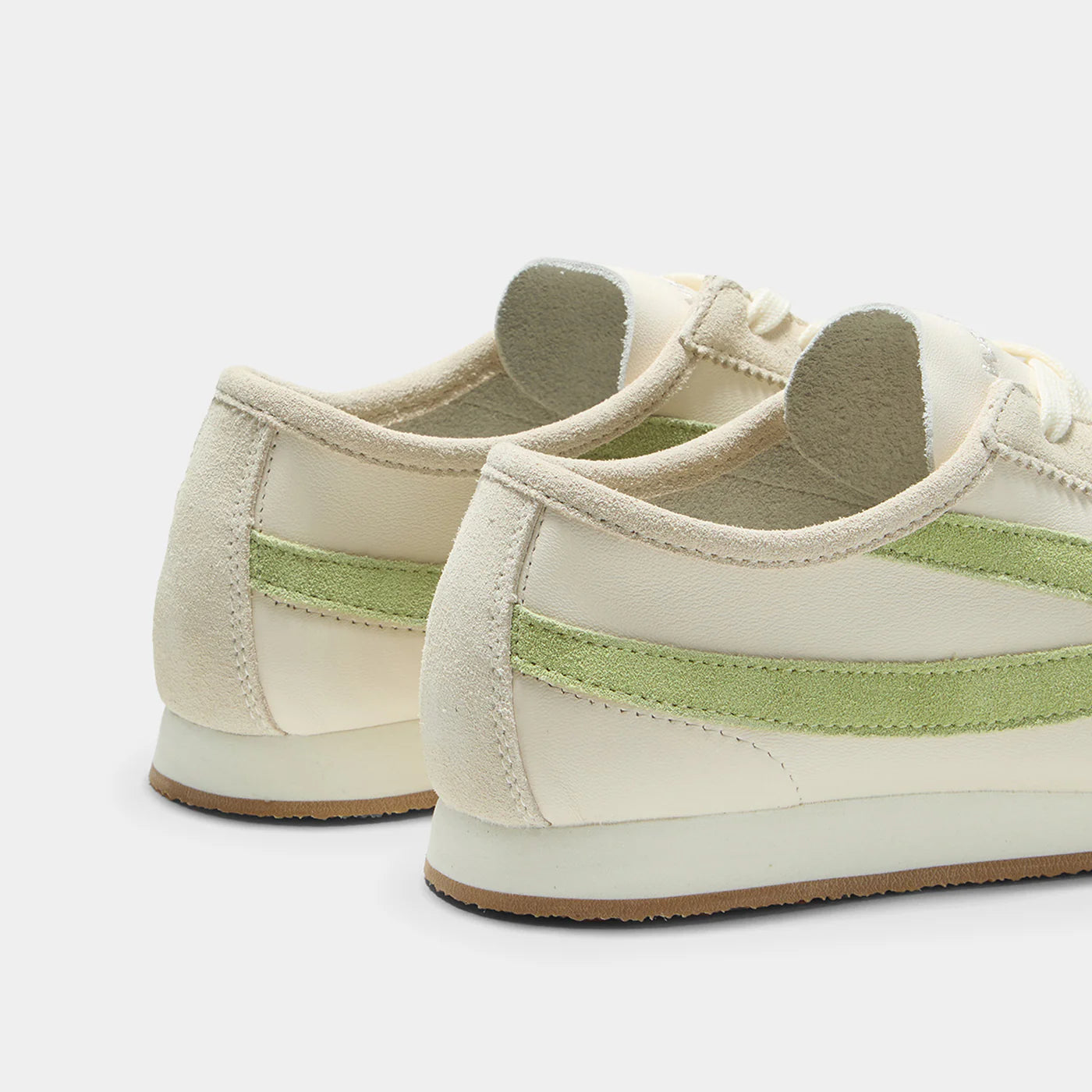 Back view of the Norman Walsh sneaker in Beige and Grass Green, featuring premium full-grain leather and suede textures with a durable rubber sole.