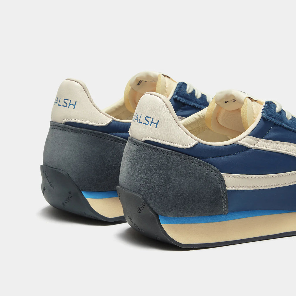 Back view of the London Navy Blue sneaker, showing the refined 1970s Scintilla silhouette and weather-resistant material textures.