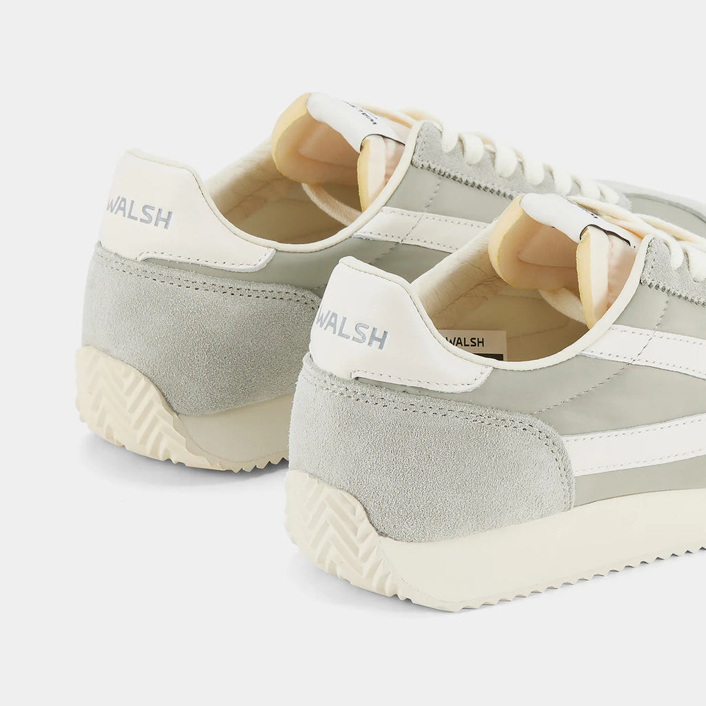 Back view of the London Beige and Bean Green sneaker, showing the refined 1970s Scintilla silhouette and weather-resistant material textures.