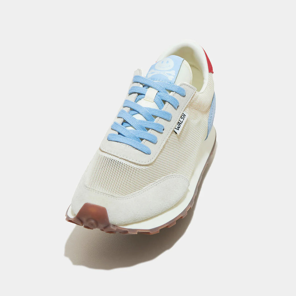 The detailed view of Norman Walsh LA84 Sky Blue & Red — an Olympics-inspired retro runner with perforated mesh upper, EVA cushioning & rubber outsole. 