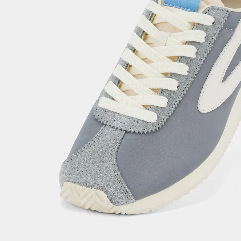 Close-up view of the London Beige and Gray sneaker, showing the refined 1970s Scintilla silhouette and weather-resistant material textures.