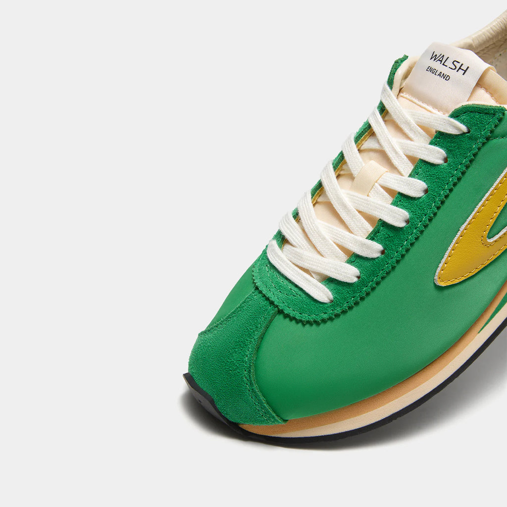 Close-up view of the London Vintage Green sneaker, showing the refined 1970s Scintilla silhouette and weather-resistant material textures.