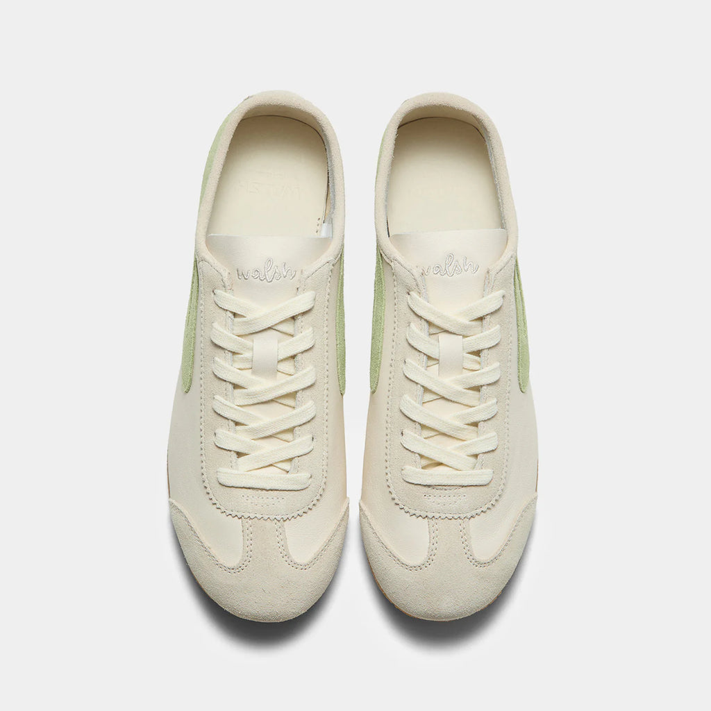 Top-down view of the Norman Walsh sneaker in Beige and Grass Green, featuring premium full-grain leather and suede textures with a durable rubber sole.