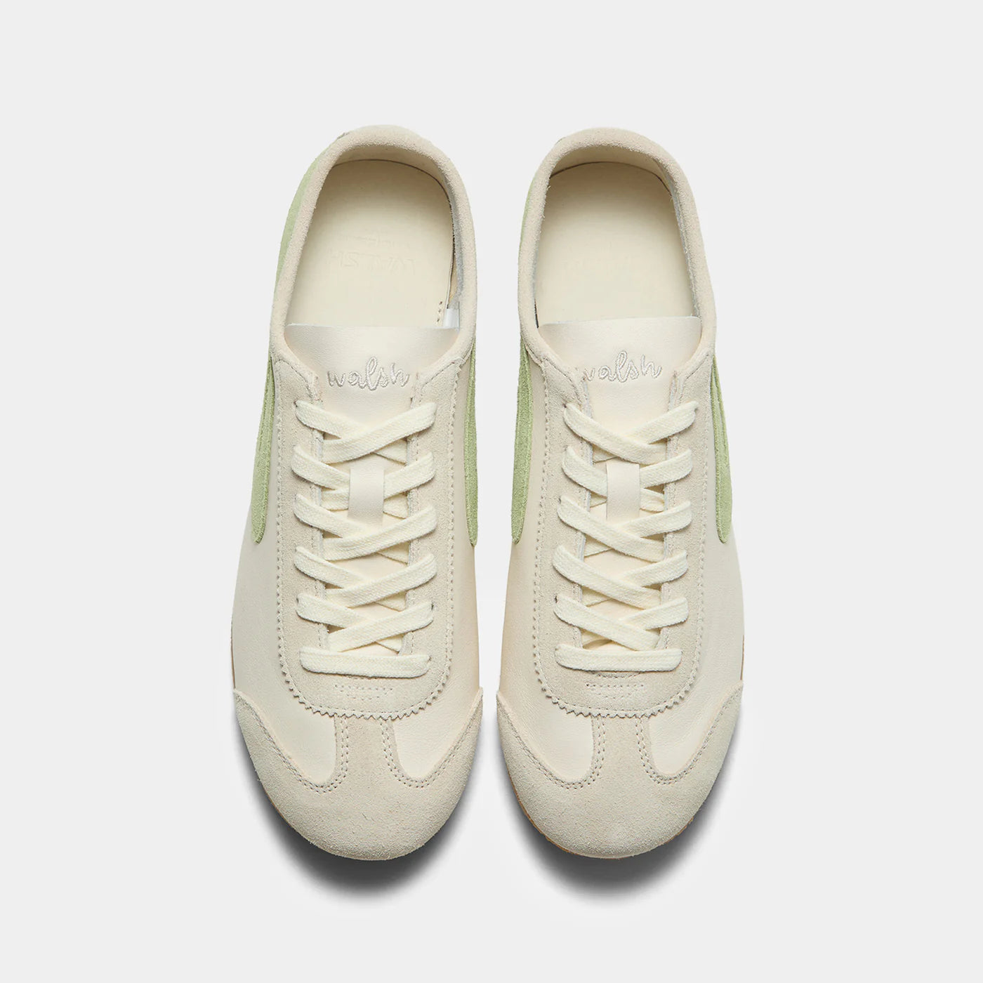Top-down view of the Norman Walsh sneaker in Beige and Grass Green, featuring premium full-grain leather and suede textures with a durable rubber sole.