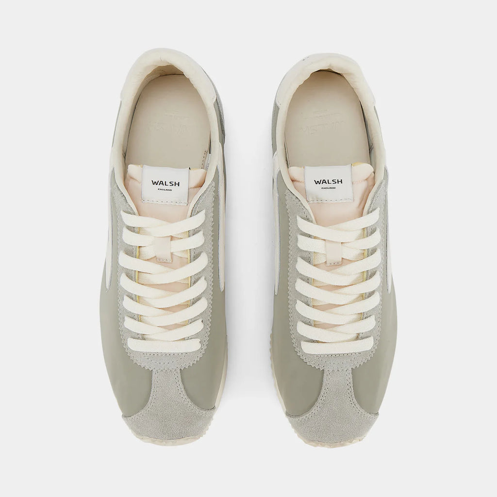 Top-down view of the London Beige and Bean Green sneaker, showing the refined 1970s Scintilla silhouette and weather-resistant material textures.