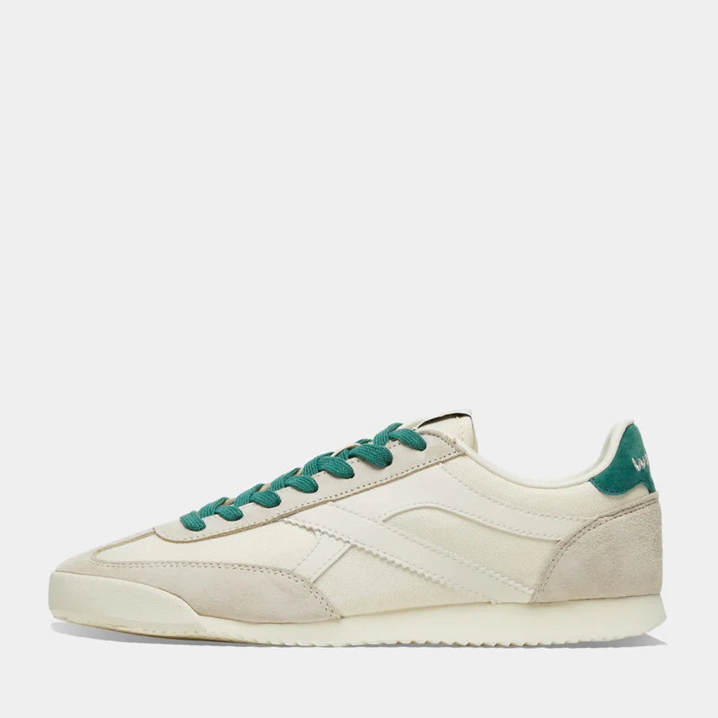 The side view of Norman Walsh Chicago Beige & Army Green — heritage nylon & velvet upper, latex-cork insole, lugged rubber outsole. 