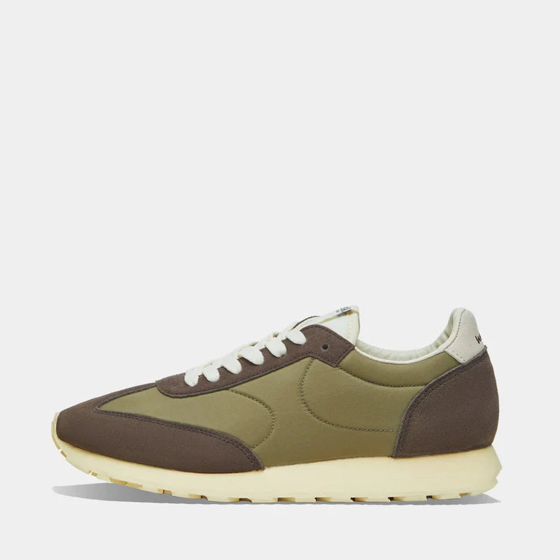 Side view of the Thames collection in Green and Brown, featuring a wide toe box and smooth artistic silhouette
