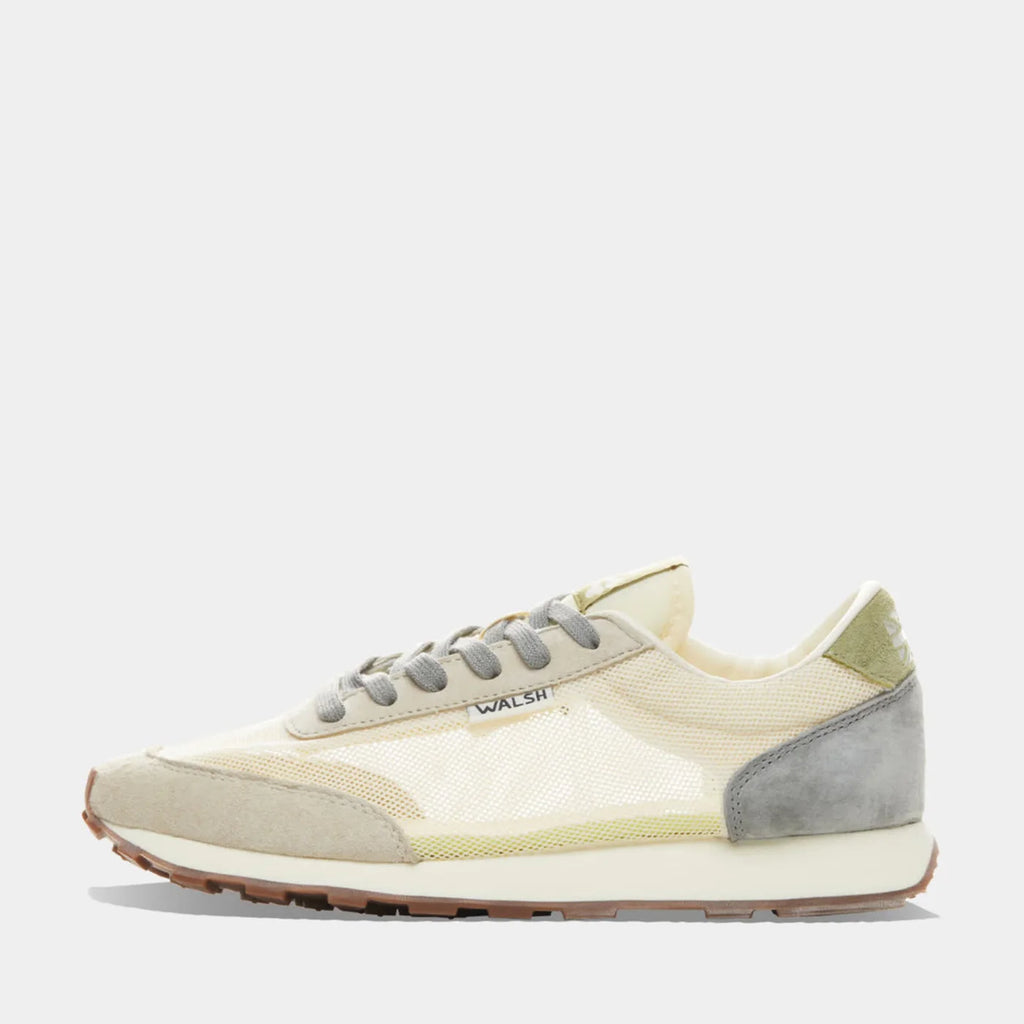 The side view of Norman Walsh LA84 Beige & Haze Green — an Olympics-inspired retro runner with mesh upper, EVA cushioning & rubber outsole. 