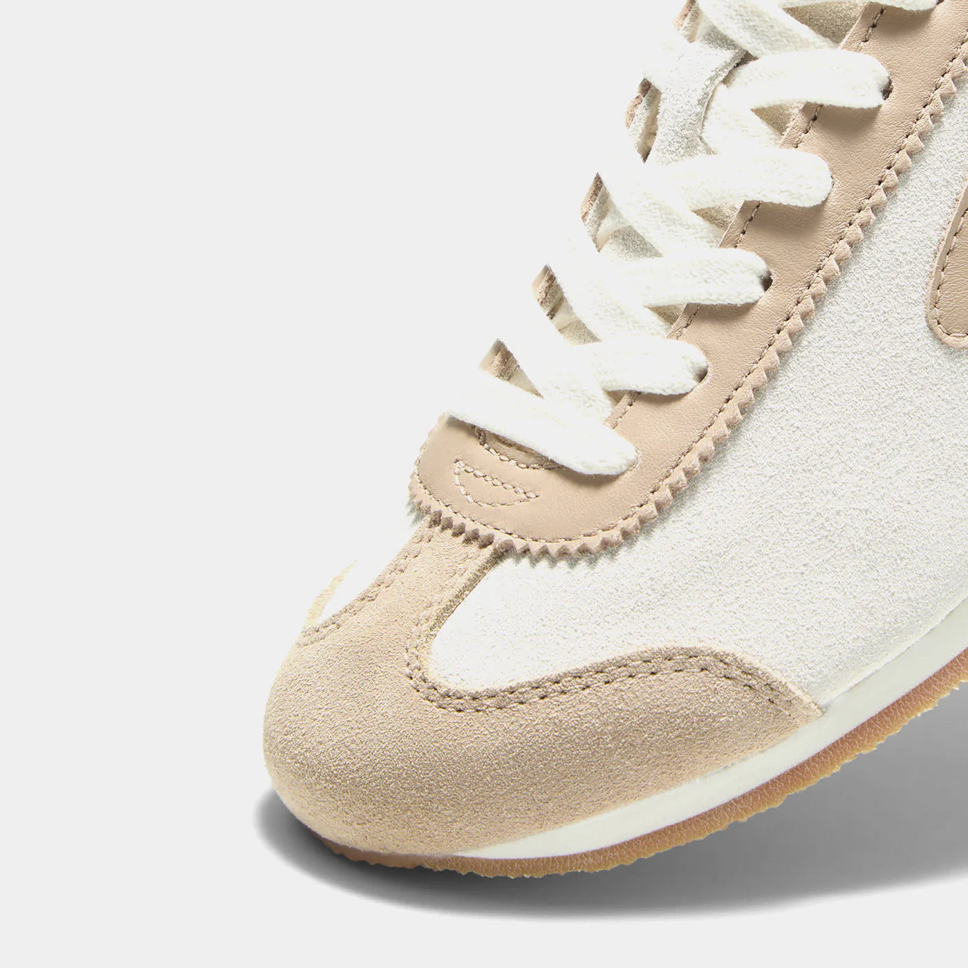 Close-up view of the Norman Walsh sneaker in Beige and Khaki, featuring premium full-grain leather and suede textures with a durable rubber sole.