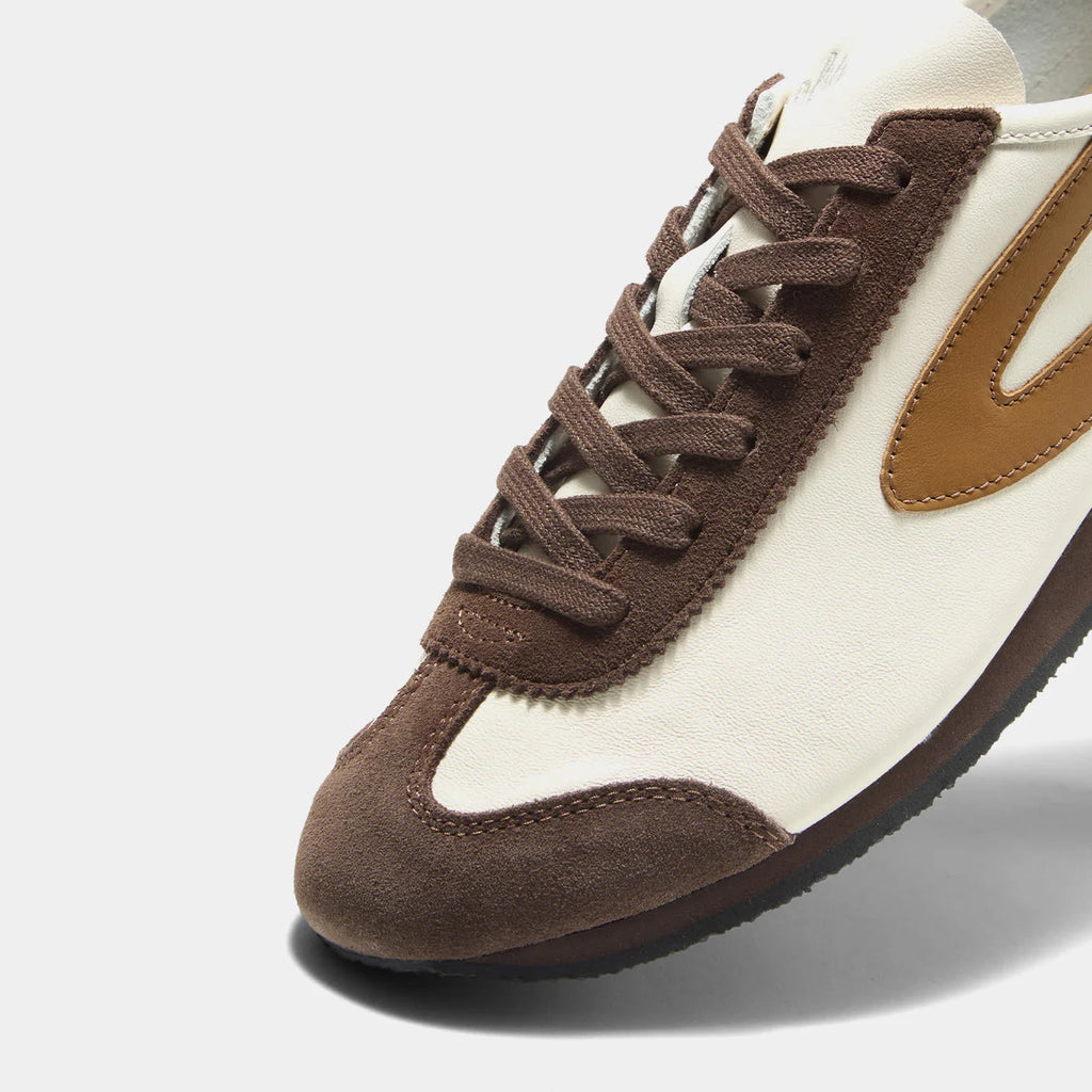 Close-up view of the Norman Walsh Palm shoe in Reddish and Brown leather and suede.
